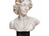 marble bust of a woman with curly hair and a black dress