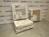 two boxes of items sitting on the floor in front of a wall