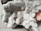 a close up of a piece of rock with crystals on it