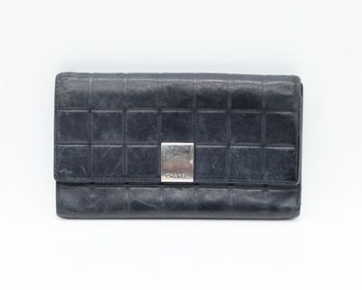 black leather wallet with a metal clasp on a white background