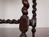 a close up view of a wooden table with a glass top