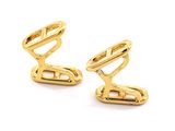 two pairs of gold plated cufflinks on a white background