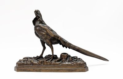 bronze sculpture of a pheasant on a rock
