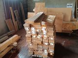 a large pile of wood sitting in a warehouse