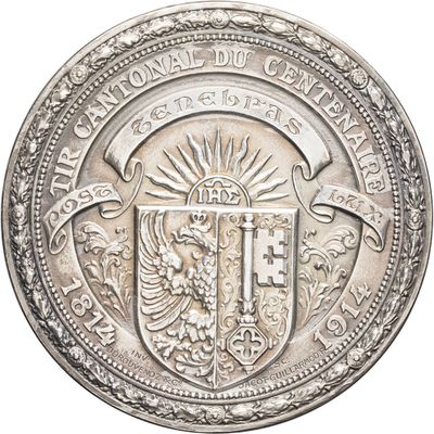 a close up of a silver coin with a coat of arms on it