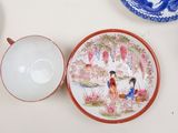 many plates and bowls that are on the table