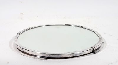 CENTRE DE TABLE rond en métal argenté enchassé d'un miroir, …
