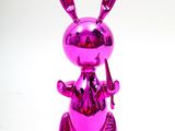 purple bunny statue with a knife and fork in its hand