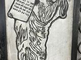 a drawing of a man holding a sign in his hand