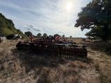 an image of a tractor plow in a field