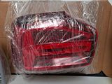 a red car wrapped in plastic sitting on top of a table