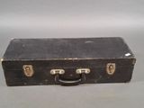 a black suitcase sitting on a table with a handle