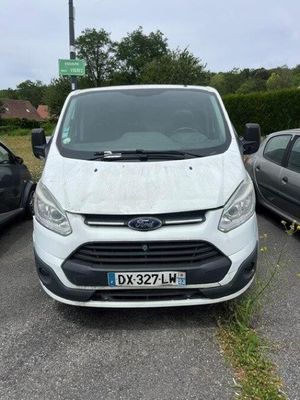 the white van is parked in the parking lot next to other cars