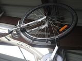 a bicycle that is sitting on the back of a car