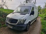 a van that is parked on the side of the road