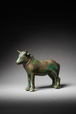 a close up of a statue of a horse on a gray surface