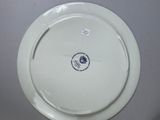 a white plate with a blue and white design on it