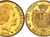 a close up of a gold coin with a crown on it