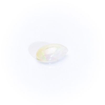 an oval white oplite stone with a white background