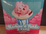 a box of candy with a pig in it on a table