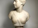 marble bust of a young man with a crown on top of his head