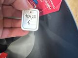 a person holding a small button in their hand