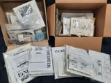 several boxes filled with different types of sewing supplies on a table