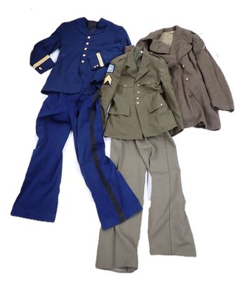 three military uniforms are lined up on a white surface