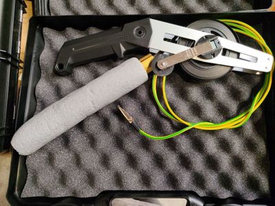 a tool that is sitting in a case on the floor