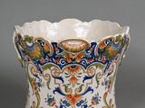 an image of a vase with a floral design on it