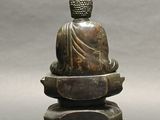statue of a person sitting on top of a lotus flower