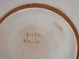 a white plate with writing on it on a table