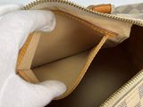 a handbag that is open on a white surface