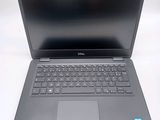 the dell laptop is open and ready to be used