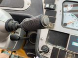 a close up of a motorcycle dashboard with a speedometer