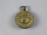 an image of a gold medal with a crown on it