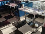 a black and white checkered floor in a diner