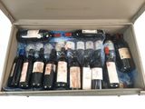 many bottles of wine in a case on the table