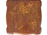 an image of a wooden tray with flowers and butterflies painted on it
