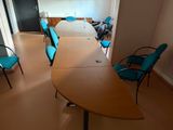 a table and chairs in a room that is empty