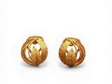 pair of gold earrings with leaves on them on a white background