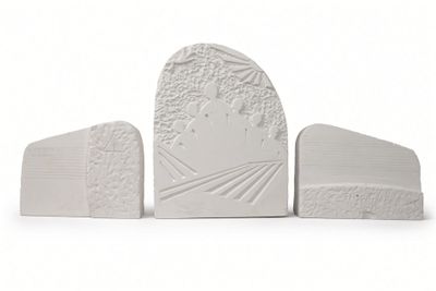 three white bookends that are sitting next to each other