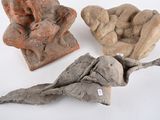 three pieces of clay sitting on top of a table next to each other