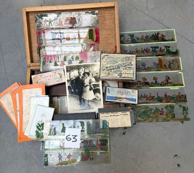 many cards and postcards in a wooden box on the ground