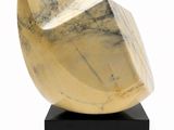 marble sculpture of a shell on a black base on a white background
