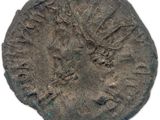 une pièce de monnaie ancienne sur laquelle figure le portrait d'un homme