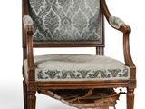 an image of a chair with a patterned upholstered back and arms