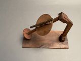 a wooden model of a machine that is on a table
