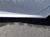 a close up of a car ' s paint job on the side of the car