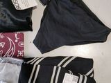 a lot of clothing that is sitting on a table